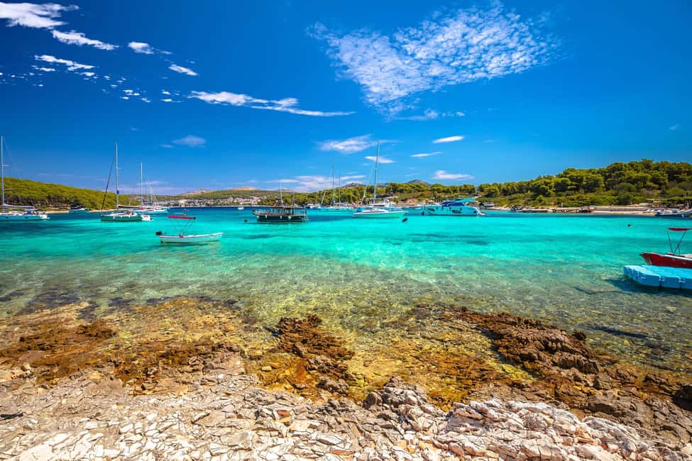 From Hvar: Blue Cave, Green Cave & 5 Islands Speedboat Tour - Stiniva Cove on Vis: the beach with a photo problem solved