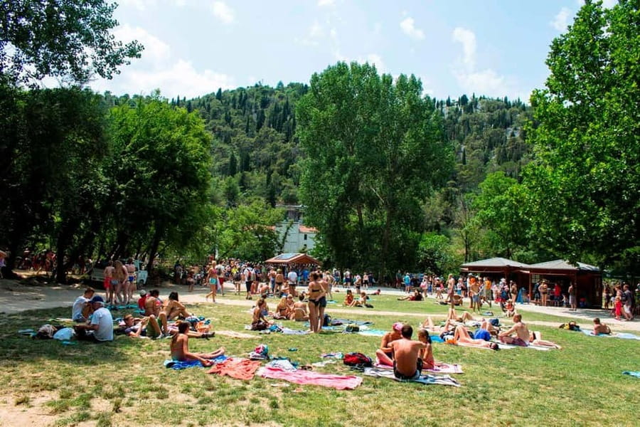 From Split: Krka Waterfalls Tour with Boat Ride & Swimming - Skradin time: beach swimming and a calm, real-town feel