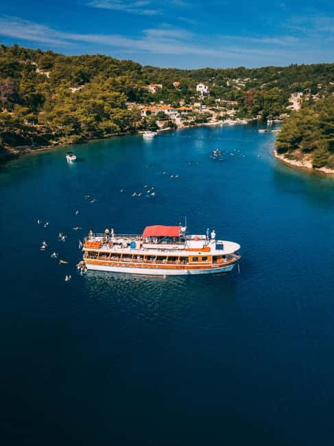 From Trogir: Blue Lagoon & Šolta Cruise with Lunch & Drinks - Blue Lagoon time: snorkeling, calm water, and the beach bar rhythm
