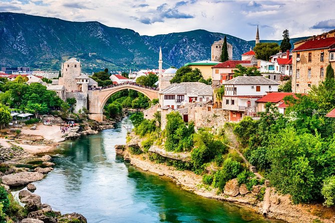 Mostar and Kravica Waterfall Discovery Day Trip from Split or Trogir - Mostar Old Bridge walk: Stari Most, Old Bazaar, and Ottoman details