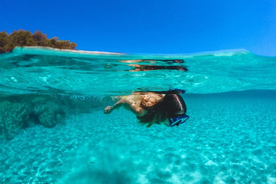 Split: Blue Lagoon, Hvar and 5 Islands Small Group Boat Tour - Pakleni Islands: swim stop in the archipelago with a Carpe Diem reference